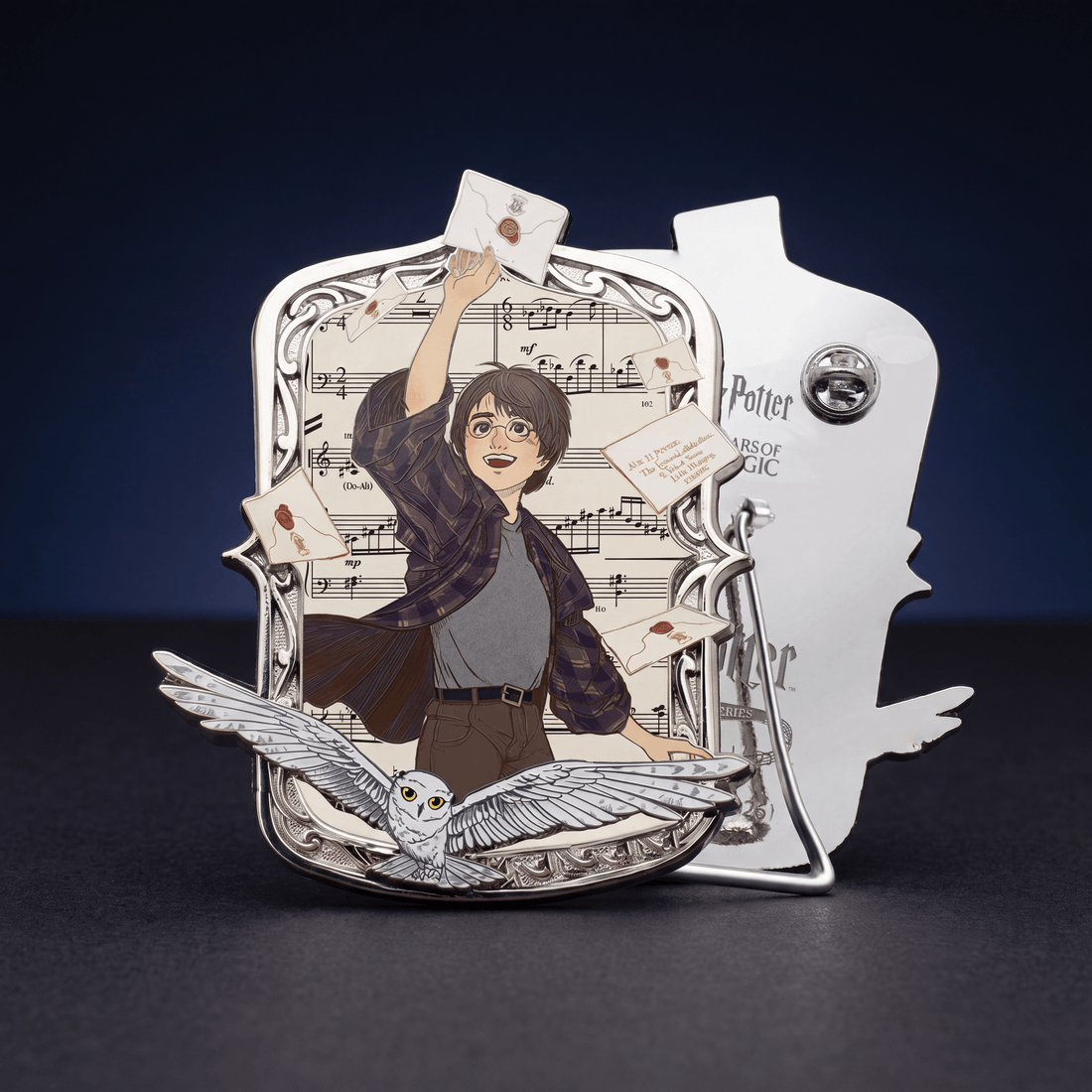 The pin's front and reverse — butterfly clips and the fitted table stand